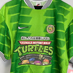 Shop 1998/99 CULT KITS X TURTLES JAPANESE MOVIE MASHUP (L) NIKE, classic football shirts, vintage football shirts & retro soccer jerseys at Cult Kits