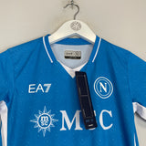 Shop 2024/25 Napoli *BNWT* Stadium Home Shirt (Kids - Multiple Sizes) EA7, classic football shirts, vintage football shirts & retro soccer jerseys at Cult Kits