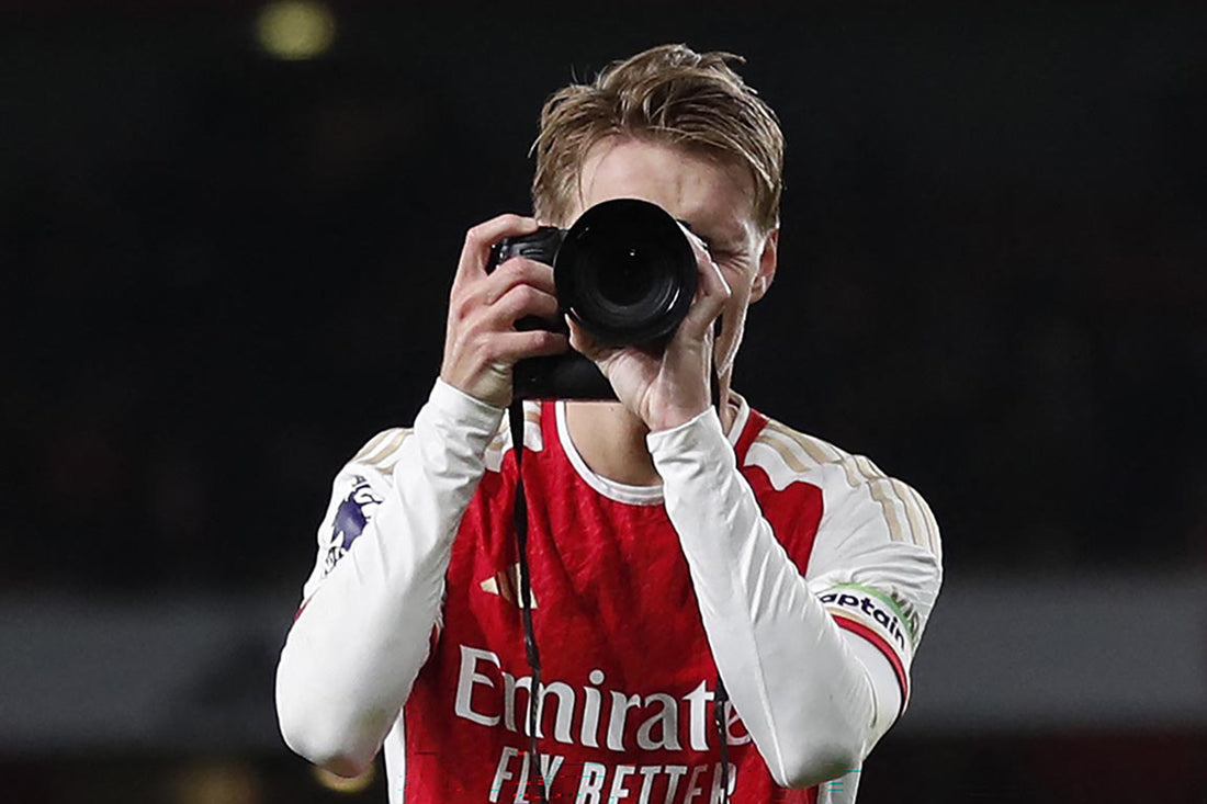 cult kits arsenal over celebrating odegard with camera