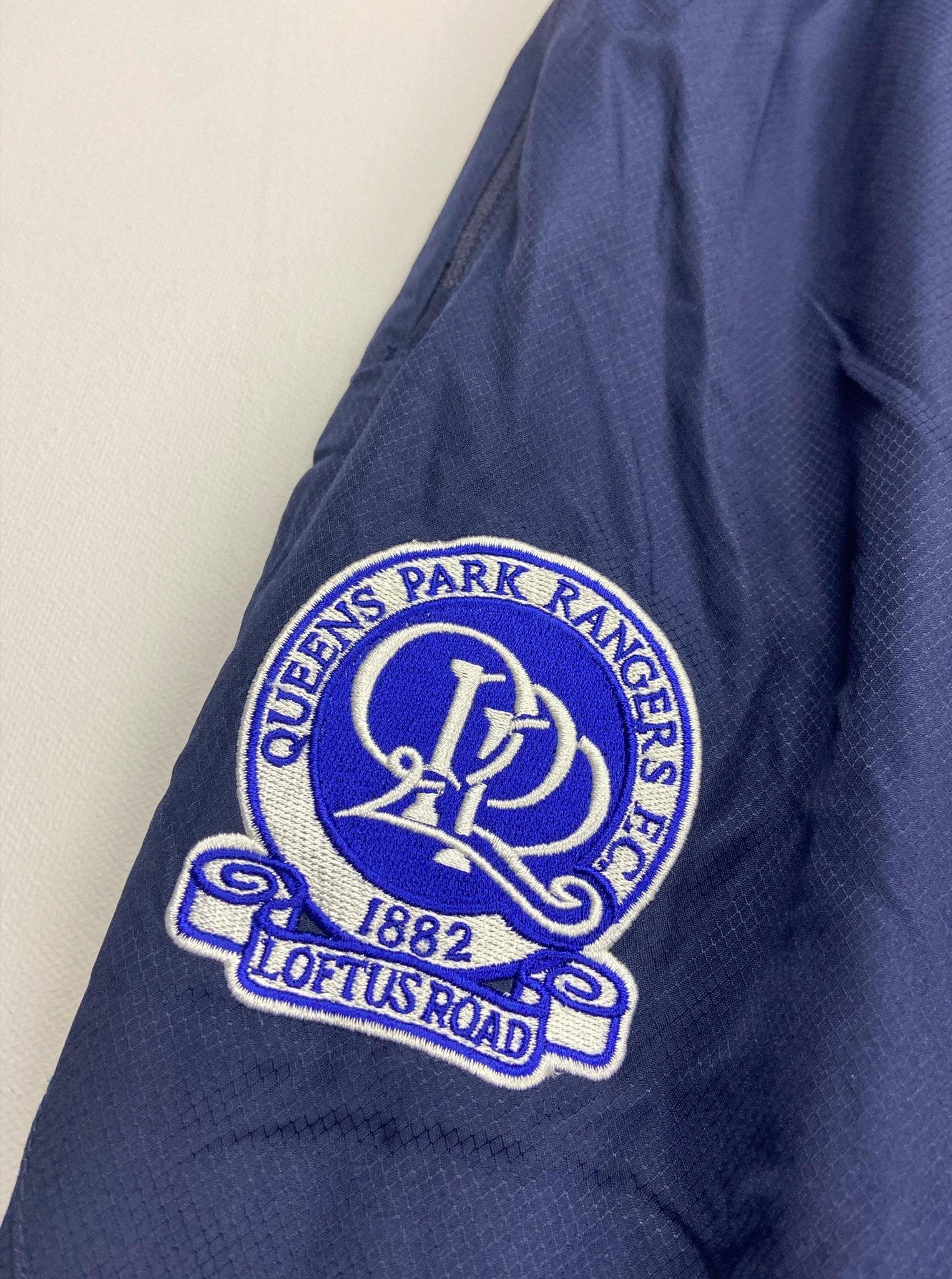 Shop 2006/07 QPR TRACKSUIT BOTTOMS (XL) LE COQ, classic football shirts, vintage football shirts & retro soccer jerseys at Cult Kits