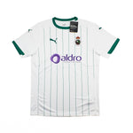 A white Puma Racing Santander home soccer jersey with green pinstripes, green collar and sleeve trim, featuring the purple Aldro sponsor logo on the front.
