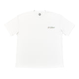 A white short-sleeve crewneck t-shirt with a small 'El Kaiser' graphic printed on the left chest in green and black, displayed flat against a white background.