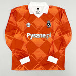 2024/25 Pyszne.pl Cult Kits football jersey in orange with diamond pattern, featuring logo and collar, available in multiple sizes.
