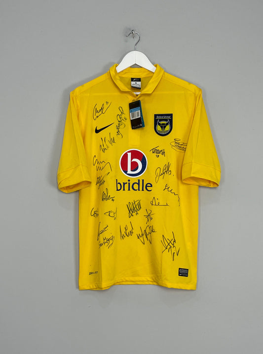 Image of the Oxford squad signed shirt from the 2012/13 season