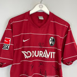 2009/10 FREIBURG GLOCKNER #19 *SQUAD SIGNED* HOME SHIRT (L) NIKE