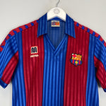 1984/89 Barcelona home shirt by Meyba in excellent condition, featuring blue and red stripes, size small.