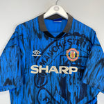 1992/93 Manchester United away shirt in blue, size XL, by Umbro, featuring vibrant colors and vintage design.