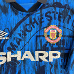 1992/93 Manchester United away shirt by Umbro in vibrant blue, featuring sponsor Sharp and iconic club crest. Size XL.