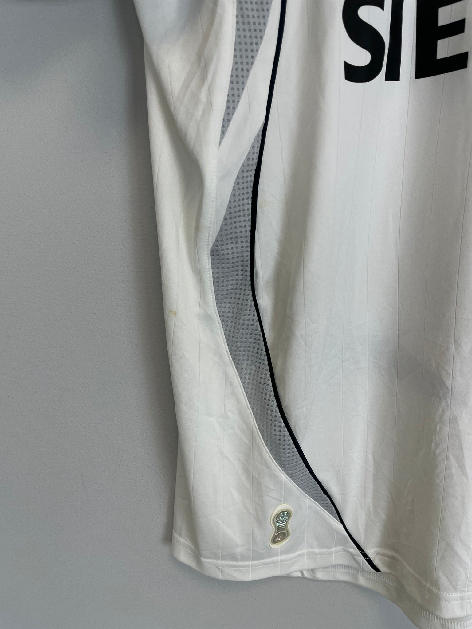 2006/07 Real Madrid Ronaldo #9 home shirt side view, showing vintage design and minor condition spots.
