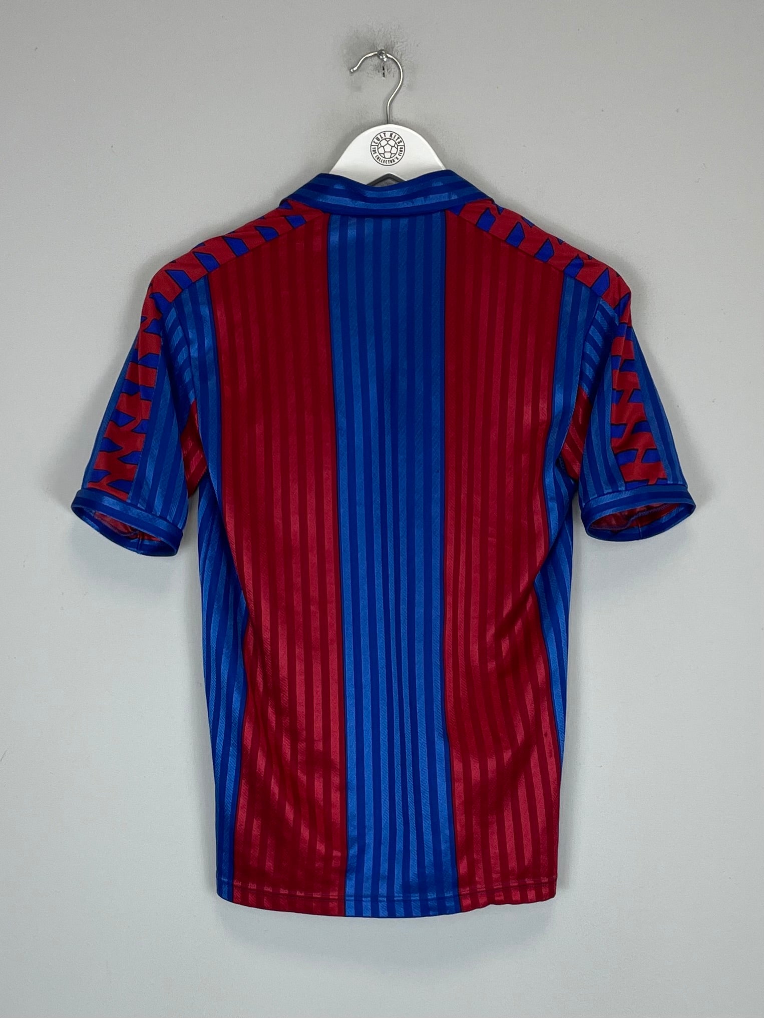 Back view of the 1984/89 Barcelona home shirt by Meyba, featuring blue and red stripes in excellent condition. Size small.