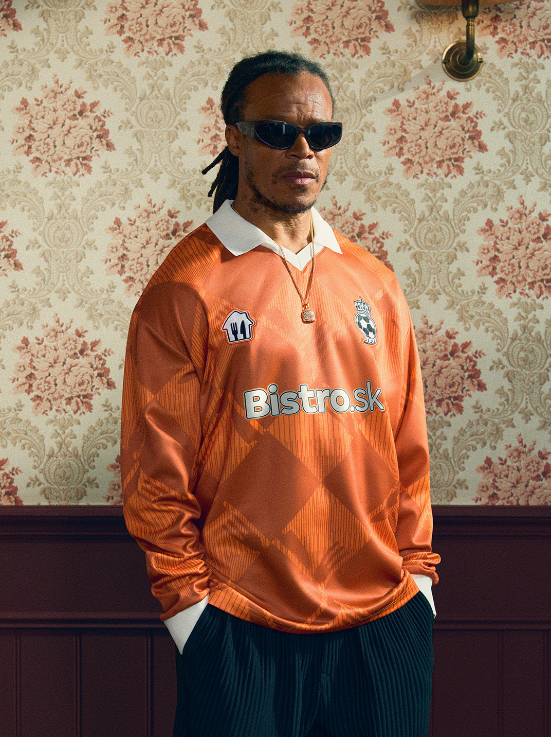 2024/25 Bistro.sk Cult Kits Football Jersey in orange, worn by a model, celebrating UEFA Champions League Final, part of Cult Kits.