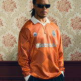 2024/25 Bistro.sk Cult Kits Football Jersey in orange, worn by a model, celebrating UEFA Champions League Final, part of Cult Kits.
